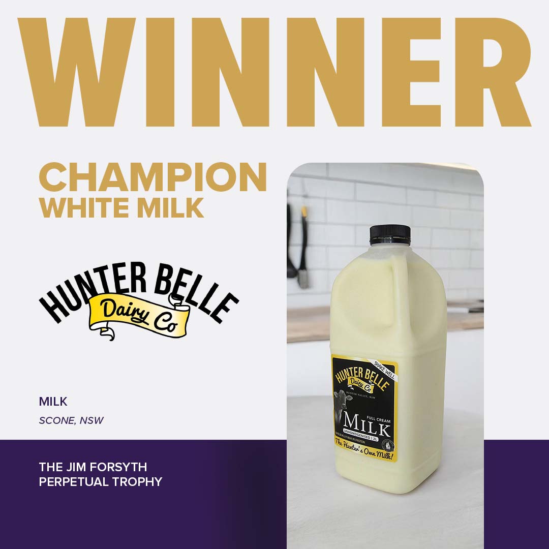 A carton of Hunter Belle Dairy Co Milk with a black label and lid, awarded Champion White Milk at the Sydney Royal Cheese and Dairy Award.