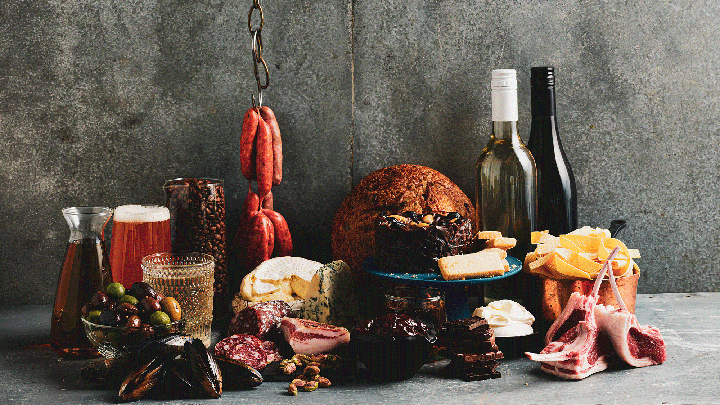 Charcuterie display of gourmet food and drinks including wine, cheese, coffee, olives and bread for the Annual President's Medal Competition.